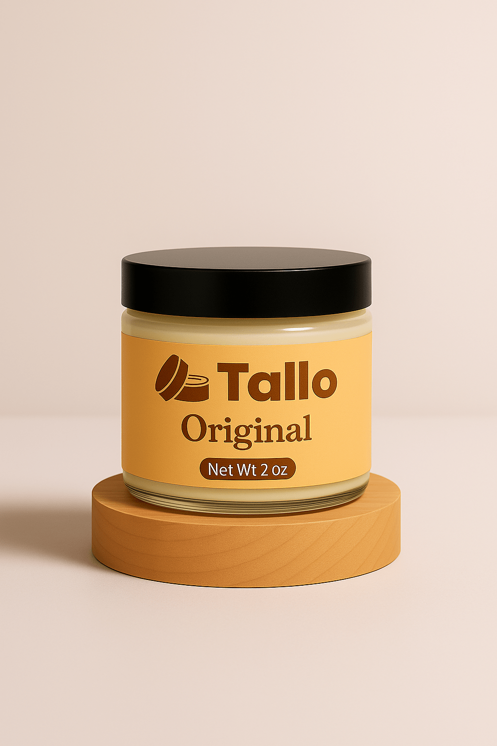 2 oz. jar of Tallo Original whipped grass fed beef tallow balm on wood block